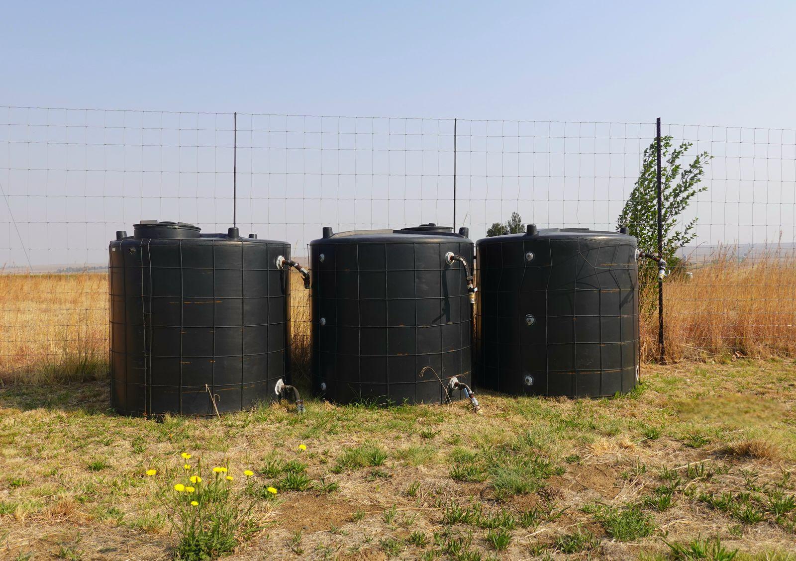Water storage tanks in a rural landscape